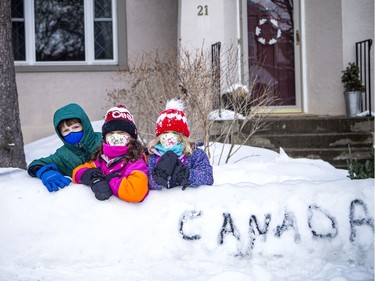 From left: eight-year-old Wyatt James, eight-year-old Elouise Perras and four-year-old Noémie Perras were excited to show off the snow bobsled to the Team Canada members Sunday.