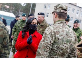 Defence Minister Anita Anand talks with soldiers during a visit to the Adazi military base, northeast of Riga, Latvia, on March 8.