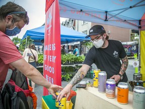 Vendors and customers sported their masks in the ByWard Market last May, in this file photo. Most Canadians have followed public health advice during the pandemic.