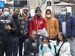 Gwen Madiba, founder of Equal Chance, bottom right, with John Addison, president of ACAO, Nassim Ashford and Macire Aribot cofounders of NoirUnited, welcoming students that the Global Black Coalition assisted in escaping Kherson, Ukraine, at the Gare de l'Est in Paris.