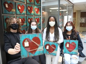 Among the group of All Saints students who have created the original works for the fundraiser for relief efforts in Ukraine are, left to right, Jude Reid, Amy Park, Tatyana Jambo and Katherine Justin.