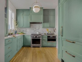 Green is an emerging colour in kitchen cabinets. Project by Tiffany Waugh.