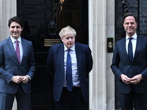 LONDON, ENGLAND - MARCH 07:  Canadian Prime Minister Justin Trudeau (L) stands next to British Prime Minister Boris Johnson (C) and Netherlands Prime Minister Mark Rutte (R) in Downing street on March 7, 2022 in London, England.