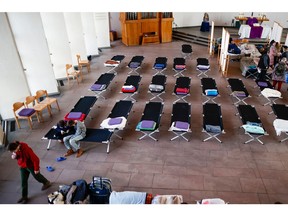 Camp beds are set up in a Protestant church in Berlin for refugees who fled Ukraine. Western nations such as Canada have opened their arms to Ukrainians.