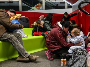 KRAKOW, POLAND - MARCH 18: A mother who fled the war in Ukraine comforts her child inside the train station on March 18, 2022 in Krakow, Poland. More than half of the roughly 3 million Ukrainians fleeing war have crossed into neighbouring Poland since Russia began a large-scale armed invasion of Ukraine on February 24, 2022.