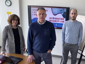 Serge Blais, (centre) executive director of the University of Ottawa Professional Development Institute, with associate director Anne-Chantal Soucie and Nicolas Rutherford, a graduate student of anthropology. Friday, Mar. 4, 2022.
