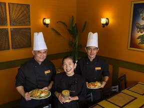 Pookie's Thai owner, Pookie McGowan, middle, with head chef Wannawat Kaewbuarabut, left, and sous chef Sema Fuangkana. When the restaurant on Carling Avenue re-opens its dining room on April 1, some prices will rise by a dollar.