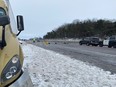 Provincial investigators at the scene of a crash that killed five peole and injured two others early Saturday morning on the westbound section of Highway 401 near Trenton.