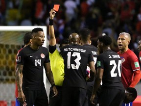 Canada's Mark-Anthony Kaye is shown a red card by referee Said Martinez in the Canada vs Costa Rica match March 24, 2022, at The National Stadium of Costa Rica, San Jose.