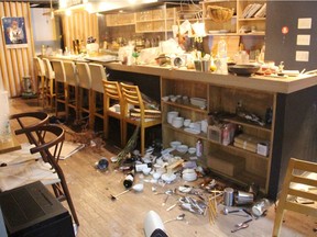 A picture shows tableware scattered on the ground at a restaurant following an earthquake, in Fukushima on March 16, 2022. - A powerful 7.3-magnitude quake jolted eastern Japan on the night of March 16,, 2022, rattling the capital Tokyo and prompting a tsunami advisory for parts of the northeast coast.