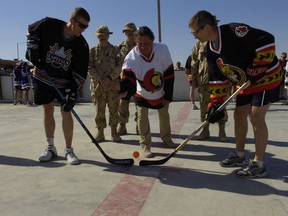 Ottawa Senators owner Eugene Melnyk is shown at Kandahar Airfield in 2007, where he visited Canadian troops stationed in Afghanistan and donated ball hockey equipment.