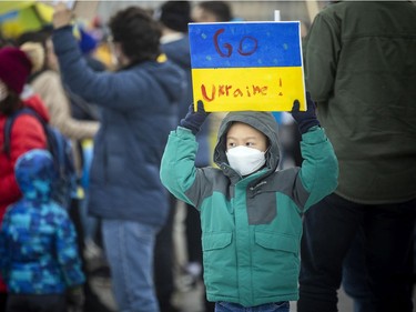 A large group gathered on Parliament Hill Sunday to stand in solidarity with Ukraine as it battles a Russian invasion.