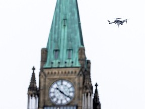 A police drone flies near Parliament Hill as police work to evict the last of the trucks and supporters occupying the downtown core on Feb. 20.