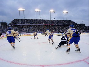Mar 13, 2022; Hamilton, Ontario, CAN; Buffalo Sabres and Toronto Maple Leafs during the 2022 Heritage Classic ice hockey game at Tim Hortons Field.