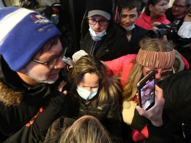 Convoy protest organizer Tamara Lich (wearing a mask) released on bail at the Ottawa Courthouse, Monday.