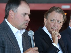 Senators general manager Pierre Dorion speaks while Eugene Melnyk listens during a September 2017 news conference. Dorion said Melnyk 'should be remembered as someone who cared a lot about the Ottawa Senators, who wanted to see them have success.'