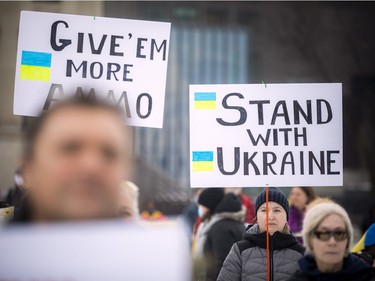 A large group gathered on Parliament Hill Sunday to stand in solidarity with Ukraine as it battles a Russian invasion.