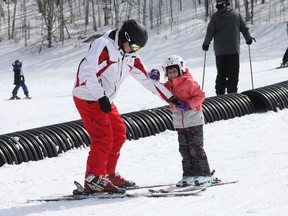 Jeff Fawcett is teaching his daughter Aliana, 4.5 years old while they are enjoying the Camp Fortune Ski Hill during Ontario March Break, March 14, 2022.