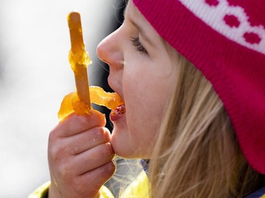OTTAWA -- Since 1920 the Proulx family have operated their sugar bush in Cumberland. Four year old Katy enjoys her taffy on Wednesday, Mar. 16, 2022