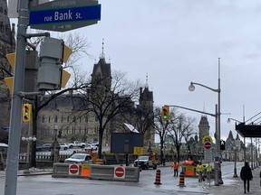 The city has put up massively inhospitable barriers on Wellington St., which make it seem as though the street is closed. It is, in fact, open to pedestrians, cyclists and authorized vehicles.