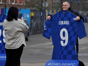 Fans take images at an entrance to Stamford Bridge, the stadium for Chelsea Football Club in London, Britain on March 3.