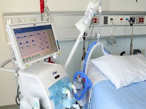 File: A ventilator stands beside a bed at Belleville General Hospital.