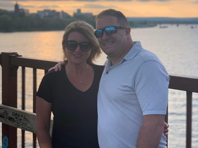 Theresa and Wayne Hughes on the Bill Thorpe Walking Bridge that crosses the St. John River and unites the north and south sides of Fredericton, N.B.