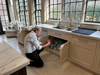 Alan Carson, a co-founder of CHIC, is seen here inspecting plumbing fixtures in a kitchen. Home buyers, who opt to wave a full home inspection, he says, are potentially putting themselves at risk.