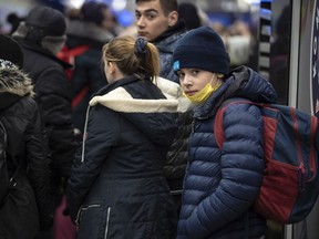 WARSAW, POLAND - March 2022 - Ukrainian refugees arrive at the Warsaw Central Train Station. Multiple trains arrive each hour, bringing hundreds of refugees from the Polish-Ukrainian border. Thousands of refugees pass through the station each day. Adam Zivo