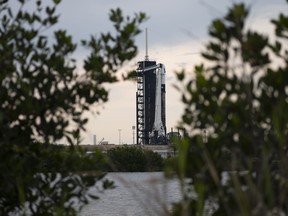 A SpaceX Falcon 9 rocket with the company's Crew Dragon spacecraft aboard is seen on the launch pad at Launch Complex 39A as preparations continue for the Axiom Mission 1 (Ax-1), on April 7, 2022 at the Kennedy Space Center in Cape Canaveral, Florida.