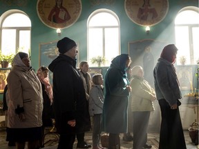 ZAPORIZHZHIA, UKRAINE - APRIL 24: People take part in an Easter Sunday service at a church on April 24, 2022 in Zaporizhzhia, Ukraine. Orthodox Easter celebrations come as Ukraine marks two months since the start of Russia's February 24 invasion, a war that has killed untold thousands of civilians and soldiers.