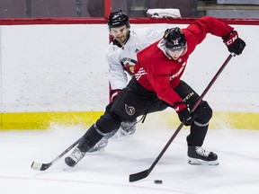 Ottawa Senators Shane Pinto (right) and Josh Brown during team practice at the Canadian Tire Centre.