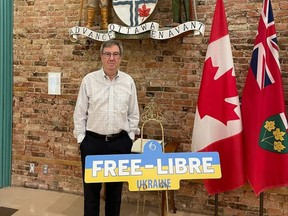 Ottawa Mayor Jim Watson is one of 61 Canadians "indefinitely prohibited from entering" Russia, as part of new sanctions announced by Russia Thursday. 
Watson with a Free Ukraine sign. Credit, Twitter