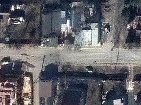 This handout satellite image released by Maxar Technologies on April 4, 2022 shows a view of Yablonska Street in Bucha, Ukraine, on March 19, 2022.