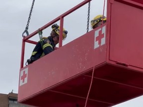 OTTAWA- April 25, 2022: Members from the Ottawa Fire Services' rope rescue team used a metal basket to rescue a construction worker who fell several metres on a job site after suffering a seizure. Source:twitter.com/ottfire