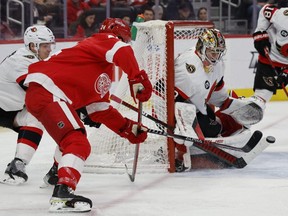 Files: Ottawa Senators goaltender Mads Sogaard makes a save on Detroit Red Wings center Pius Suter in the second period at Little Caesars Arena on April 1, 2022.