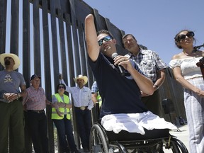 In this May 30, 2019 file photo, Brian Kolfage, founder of We Build the Wall Inc., speaks at a news conference in Sunland Park, N.M., where a privately funded wall is being constructed. Former White House adviser Steve Bannon was arrested on Aug. 20, 2020, on charges that he and three others, including Kolfage, ripped off donors to the online fundraising scheme “We Build The Wall.”