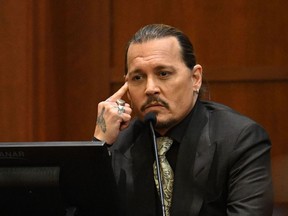 US actor Johnny Depp looks on as he testifies during his defamation trial in the Fairfax County Circuit Courthouse in Fairfax, Virginia, on April 19, 2022.