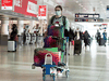 Passengers at the nearly empty departure level of Trudeau International Airport in Montreal on December 17, 2021.