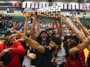 Carleton Ravens celebrate the win over the Saskatchewan Huskies during the gold medal U Sports Men's Final 8 Basketball Championship, in Edmonton, Sunday, April 3, 2022.