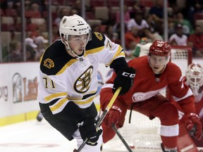 Boston Bruins right wing Zach Senyshyn (71) is pursued by Detroit Red Wings defenceman Dan Renouf, Sept. 30, 2016, in Detroit. Zach Senyshyn made his debut with the Ottawa Senators on Monday night.