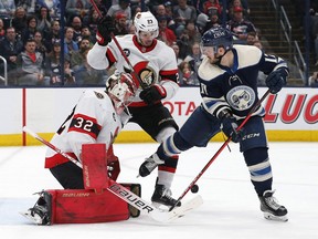 Ottawa Senators goalie Filip Gustavsson (32) makes a pad save as Columbus Blue Jackets centre Justin Danforth (17) looks for the rebound during the second period at Nationwide Arena, Friday, April 22, 2022.