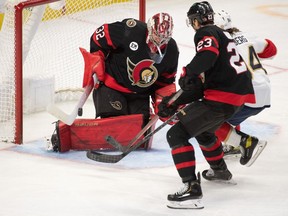 Ottawa Senators goalie Filip Gustavsson (32) makes a save on a shot from Florida Panthers left wing Ryan Lomberg (94) in the third period at the Canadian Tire Centre.