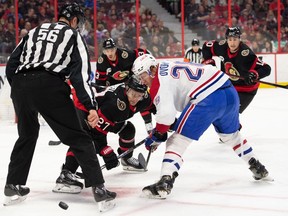 Ottawa Senators centre Dylan Gambrell (27) faces off against Montreal Canadiens left wing Christian Dvorak (28) in the first period at the Canadian Tire Centre.
