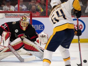 Ottawa Senators goalie Anton Forsberg (31) defends the goal in front of Nashville Predators center Mikael Granlund (64) in the first period at the Canadian Tire Centre.