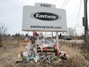 A memorial display to the victims of the explosion and fire at Eastway Tank remains near the entrance to the company property on Merivale Road.