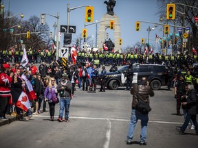 The ‘Rolling Thunder Ottawa’ motorcycle rally made its way through downtown Ottawa on a controlled route with police watching closely Saturday, April 30, 2022.