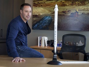 Canadian Mark Pathy is seen in his office with a model of the SpaceX starship in Montreal on Monday, November 8, 2021. Pathy is slated to embark on a 10-day journey on the maiden voyage of Texas-based Axiom Space -- paying about 50 million dollars US for the privilege.