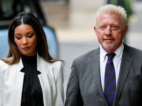Former tennis player Boris Becker arrives with his partner Lilian de Carvalho Monteiro  at Southwark Crown Court to face sentencing after being found guilty of four charges earlier this month, in London, Britain, April 29, 2022.