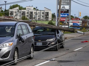 Merivale Road near Viewmount 
Drive was closed with lines down on cars.